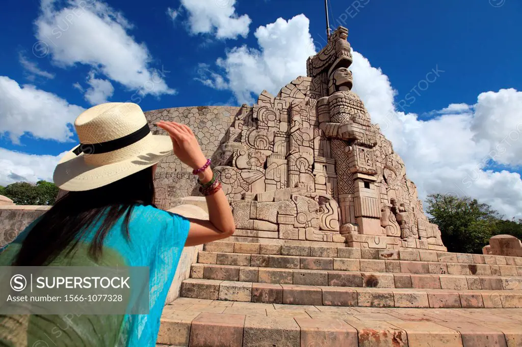 A girl in front of Monument to the Motherland Monumento a la Patria by Colombian sculptor Romulo Rozo  Merida  Mexico.