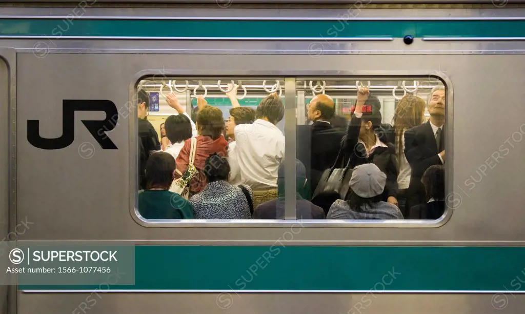 JR train during the rush hour commute at Shinjuku Station, Tokyo, Japan