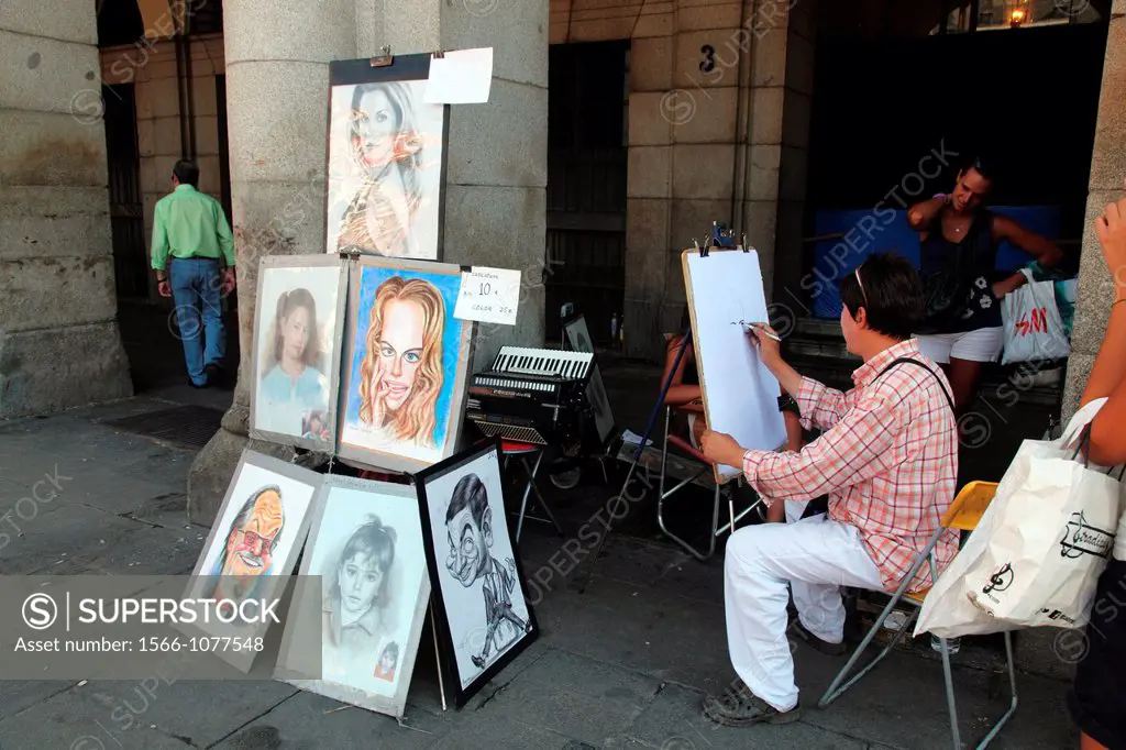 Painter and caricaturist in the Plaza Mayor in Madrid, Spain, Europe