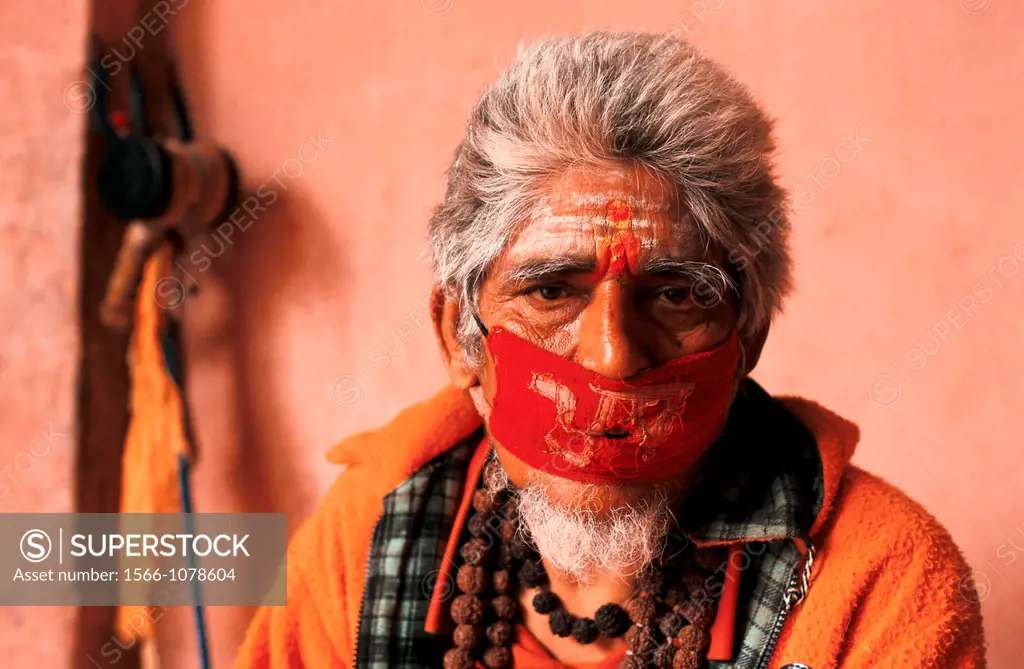 Hindu man doing austerities : he has chosen to be mute to improve his karma. From Devghat, Nepal.