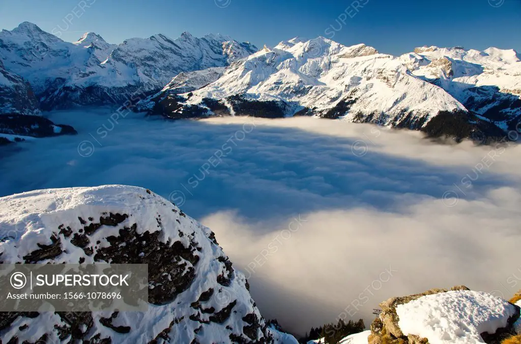 Cloud fills the Lauterbrunnen valley, below the peaks of Berner Oberland, Switzerland