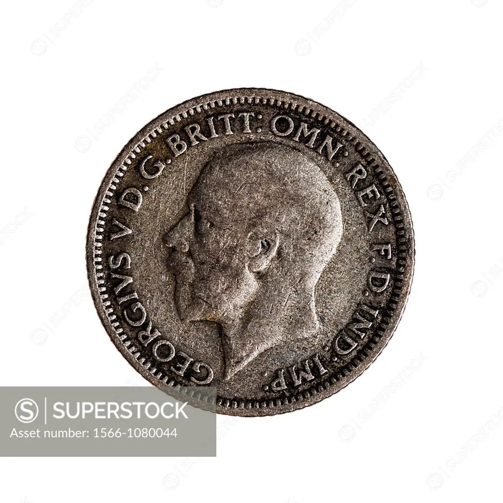 An English sixpence coin dated 1928 on a white background