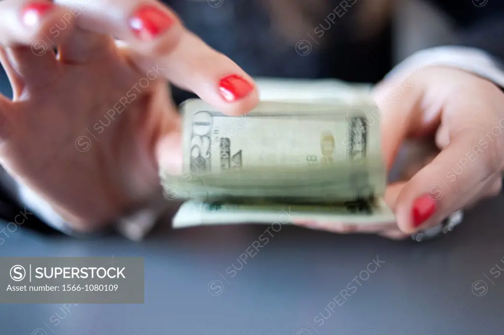 young woman hands counting U S  dollars