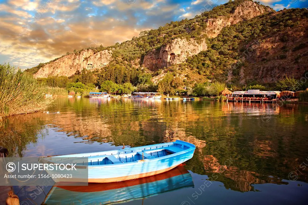 Ferry row boat on the Dalyan Çayi River looking towards boats & fish restaurant  Mediterranean coast Turkey