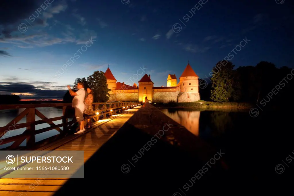 Trakai Island Castle in the lake Gatvé, Lithuania at dusk  14th century