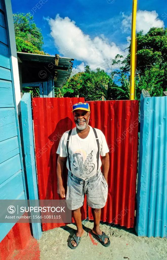 Mature Man in Front of his House