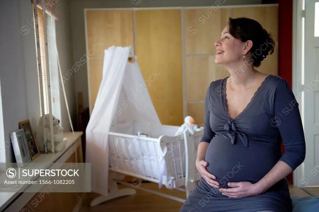 Middel-aged woman, expecting her first child, after being pregnant for 38 weeks.