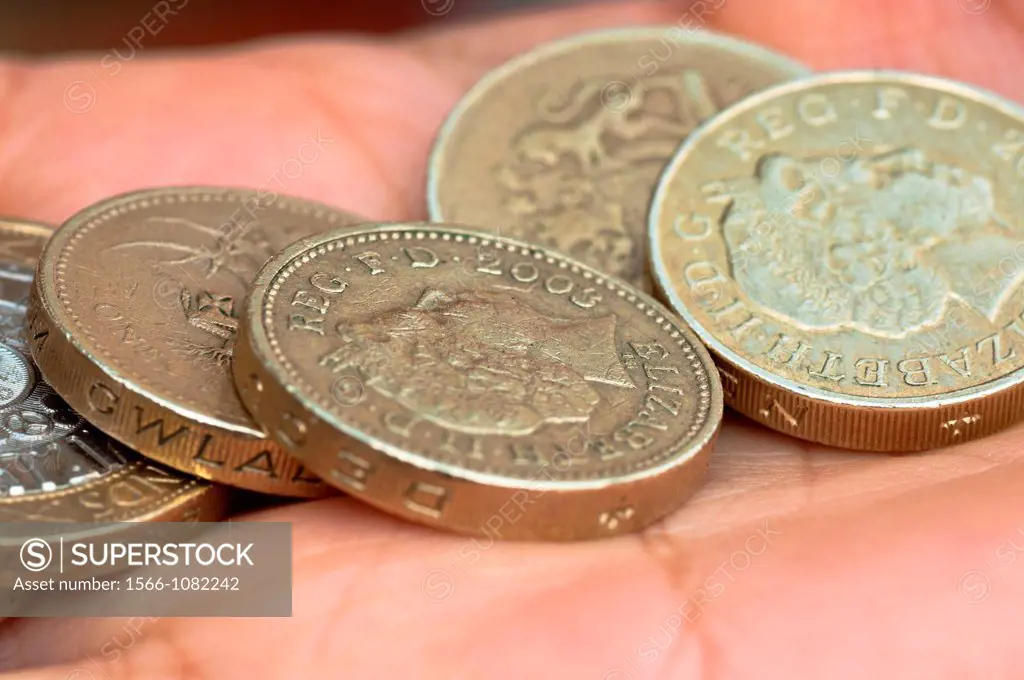 Cash in hand  £1 coins  UK