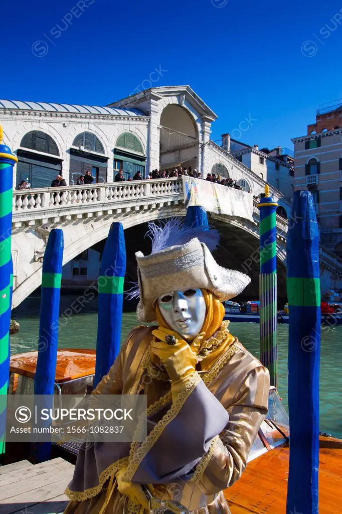 woman with fancy dress in Carnival of Venice  Rialto Bridge  Venice, Italy