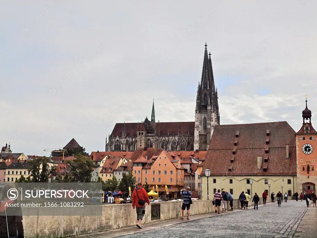 Dom St Peter the Regensburg Cathedral from the Old Stone Bridge  The clock tower arch marks the entrance to Old Town Regensburg