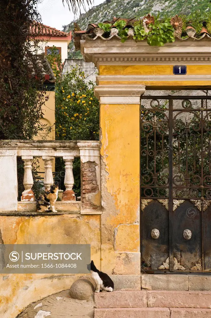 Faded elegance of a neo classic entrance to a garden in the old town of Nafplio, Greece´s first capital after independence, argolid, Peloponnese, Gree...