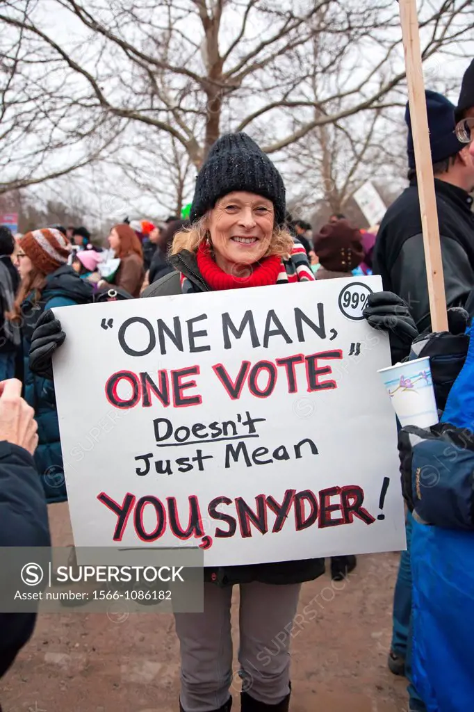 Superior Township, Michigan - Detroit resident Nancy Brigham is one of about a thousand people who marched to the home of Michigan Governor Rick Snyde...