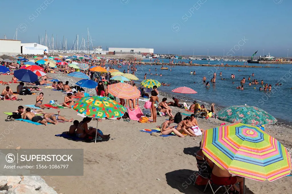 Tourists enjoy the beach in Marbella, Andalusia, Spain, Europe