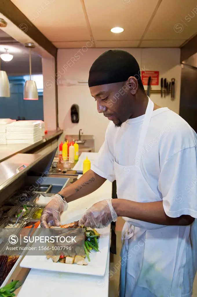 Detroit, Michigan - A worker prepares a salad in Colors Restaurant  The restaurant is a project of the nonprofit Restaurant Opportunities Center, whic...