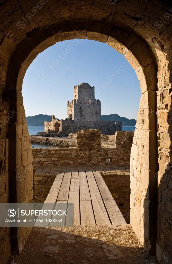 Looking through the main sea gate of Methoni fortress towards the Bourtzi tower a small fortified island and part of the fortress complex  Methoni, Me...