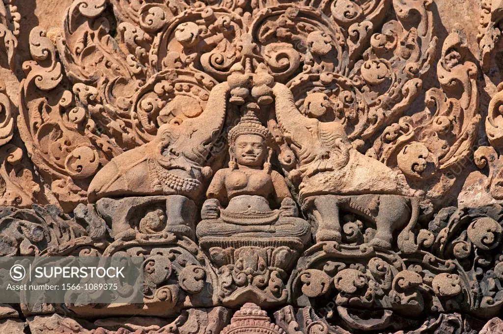 The Hindu goddess, Lakshmi, flanked by elephants, showering her with water, bas-relief of fronton at Banteay Srei temple, Citadel of the Women, Angkor...