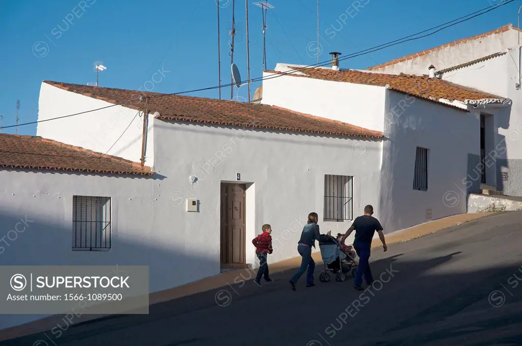 Urban view and young family, Alosno, Huelva-province, Spain,