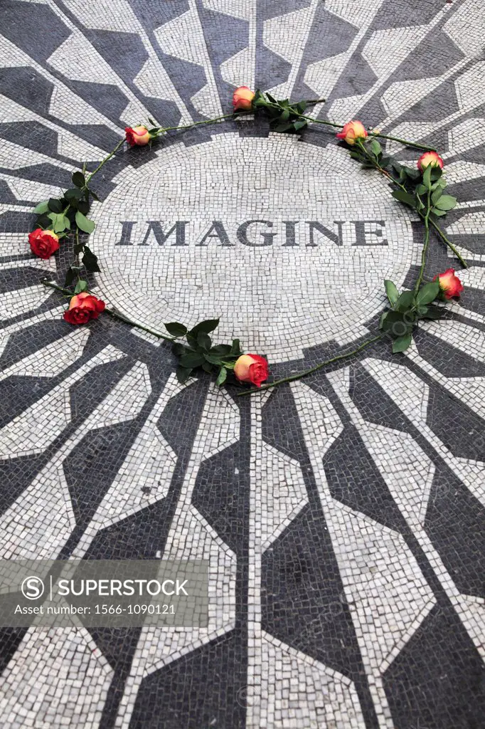 Roses decorated the Imagine mosiac to honor John Lennon in Strawberry Fields in Central Park  Manhattan  New York City.  USA.