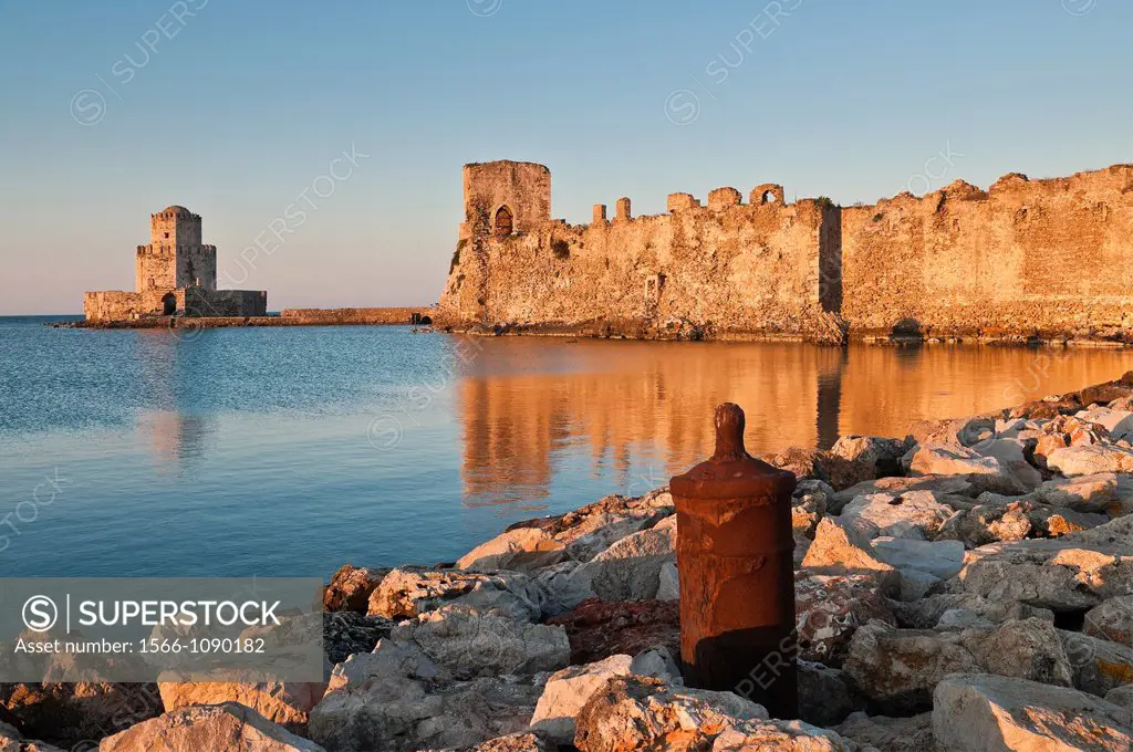 Sunrise on the Venetian walls of Methoni fortress and the Bourtzi tower a small fortified island, Methoni, Messinia, Southern Peloponnese Greece  The ...