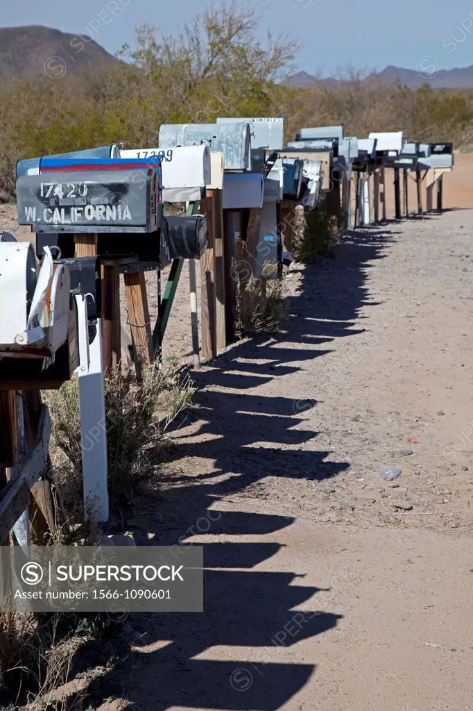 Three Pointes, Arizona - A long row of mailboxes are lined up along a dirt road in the desert west of Tucson
