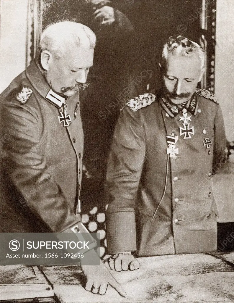 Kaiser Wilhelm II left and Field Marshal von Hindeburg studying maps during the First World War  From The Story of 25 Eventful Years in Pictures, publ...