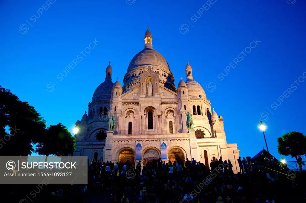 The Sacre Coeur Basilica at night in Paris, France