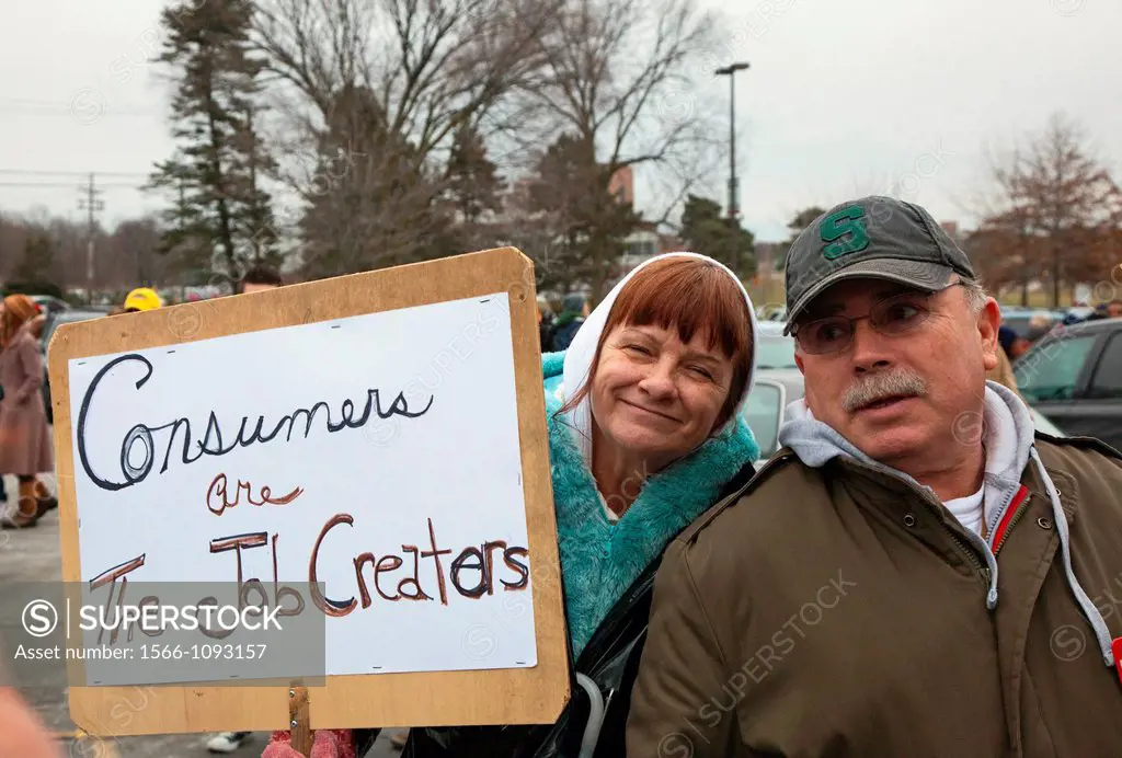 Superior Township, Michigan - A couple with their sign about job creation at a rally protesting Michigan´s emergency financial manager law
