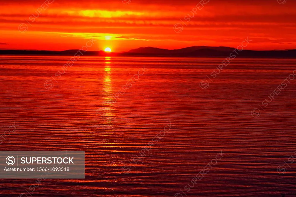 Sunrise over Haro Strait and the San Juan Islands, Victoria Cordova Bay, BC, Canada