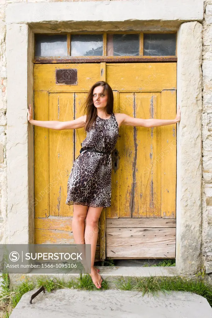 European young woman on a doorstep
