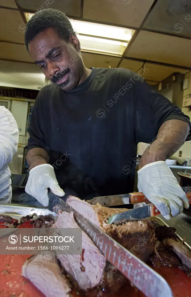 Highland Park, Michigan - A staff member prepares dinner for residents of the Detroit Rescue Mission´s Christian Guidance Center  The Center is a shel...