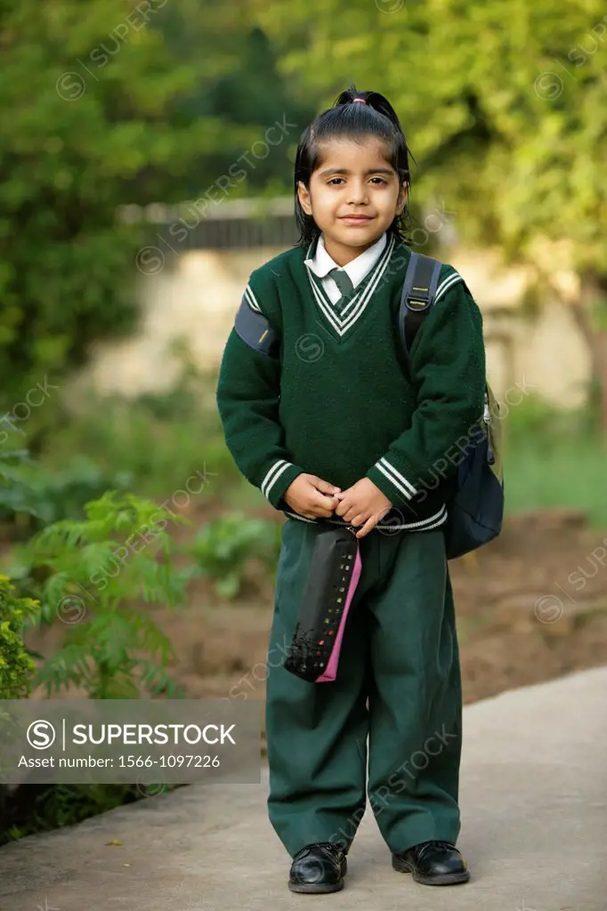 Young girl ready for school in India.