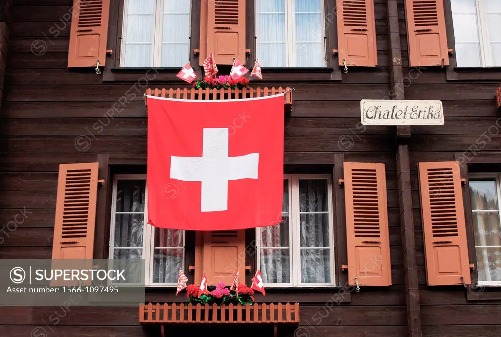 Chalet with Swiss flag in Murren, Oberland Bernese, Switzerland