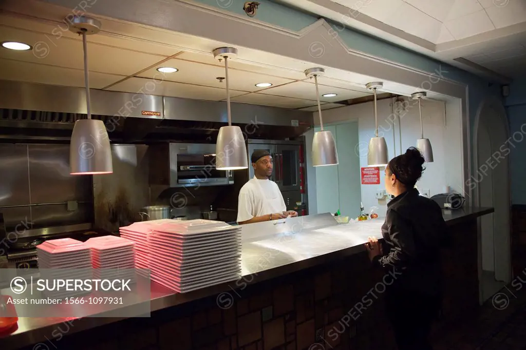 Detroit, Michigan - A server and a cook at Colors Restaurant  The restaurant is a project of the nonprofit Restaurant Opportunities Center, which work...