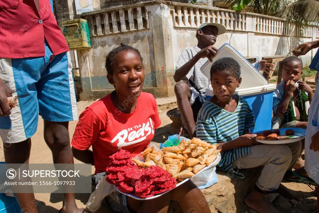 young street seller in Hell-Ville Andoany, Nosy Be island, Republic of Madagascar, Indian Ocean