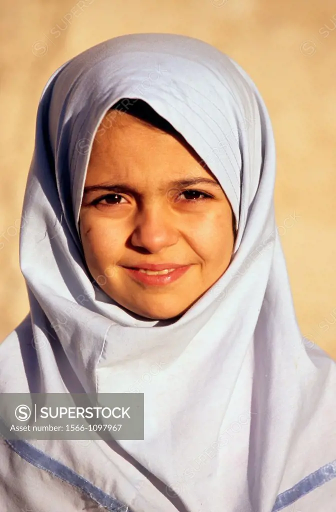 Portrait of young iranian girl in a white chador, Iran