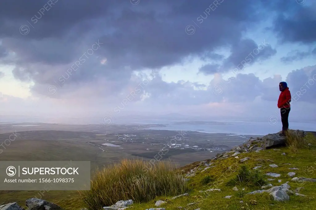 Observing the sunset over Achill Island, County Mayo, Ireland