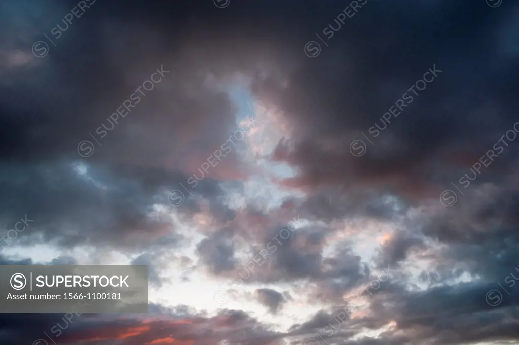 Mass of moody clouds in evening sky