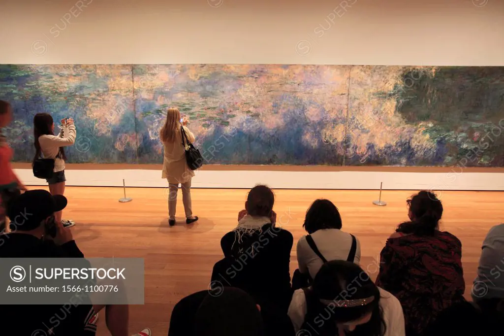 Visitors in front of Claude Monet´s Water Lilies in Museum of Modern Art MoMA  Manhattan  New York City  USA.