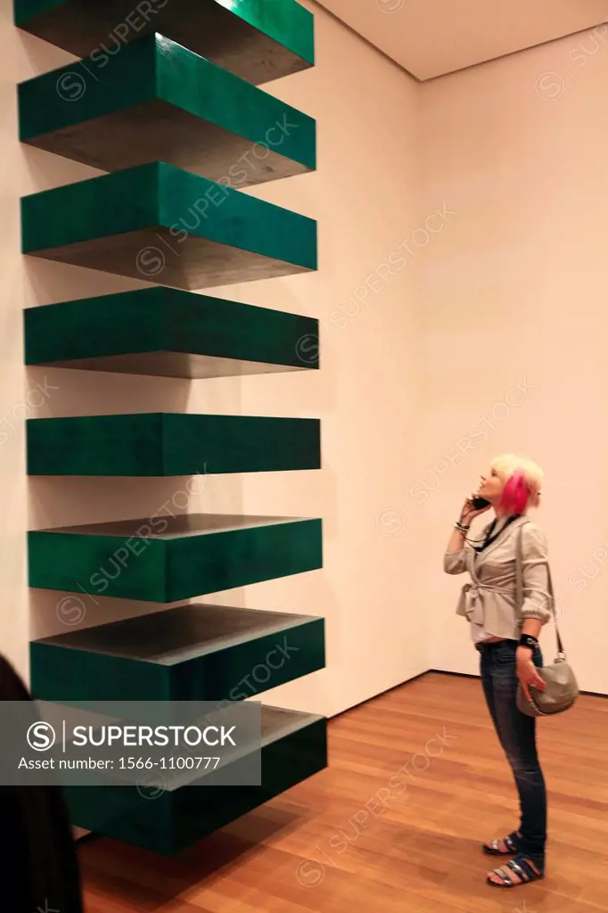 A visitor looking at a art piece in Museum of Modern Art MoMA  Manhattan  New York City  USA.