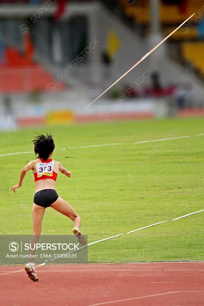 Woman throwing javelin.