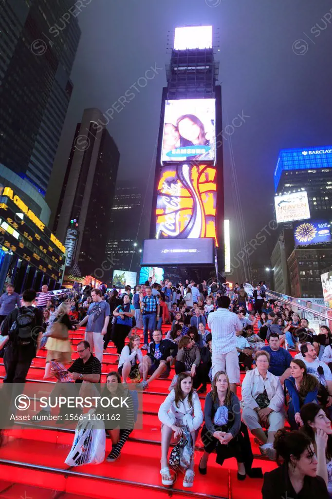 The night view of Times Square packed with visitors  Manhattan  New York City  USA.