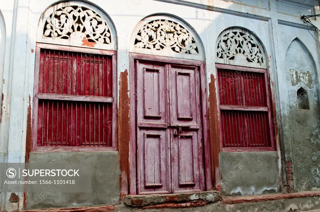 House with red windows and purple door, Vrindavan, Uttar Pradesh, India