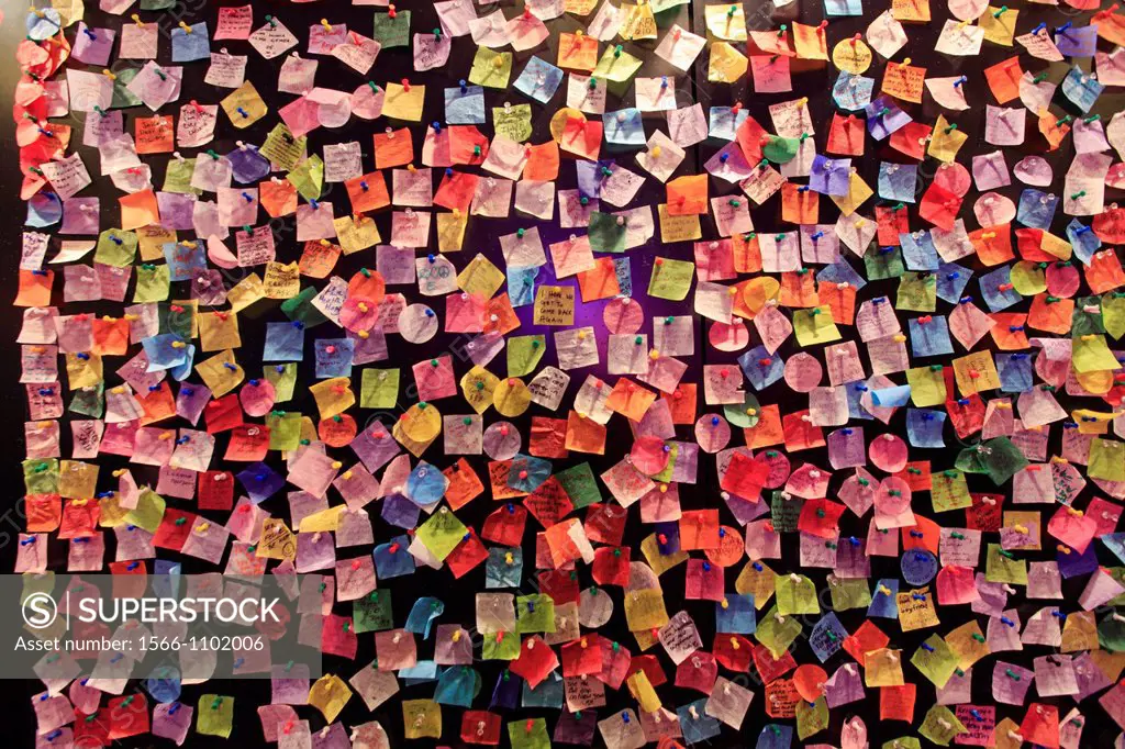 Colourful wish notes left by visitors on the wall of Times Square Visitor Center  Manhattan  New York City  USA.