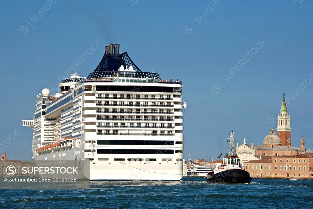 Tourist Cruise liner and vaporetto sailing on Bacino di San Marco, Venice, Italy.