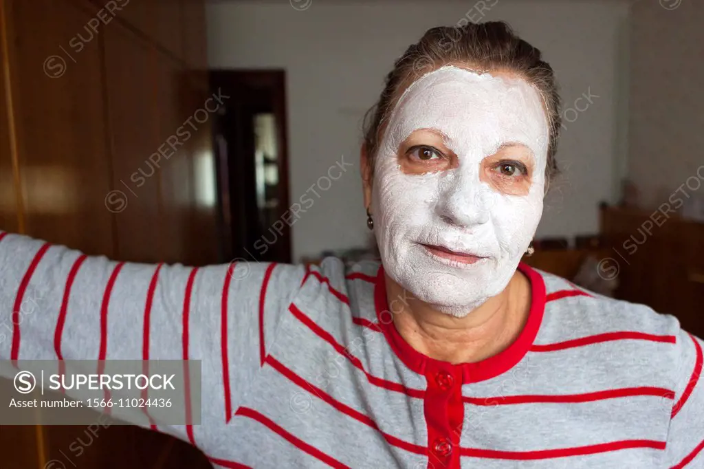 Woman looking at camera with moisturizing mask.