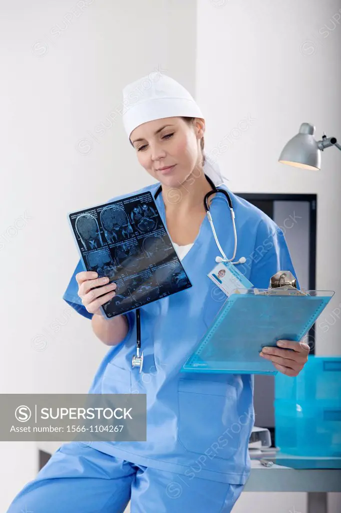 Female Nurse examining an X-ray