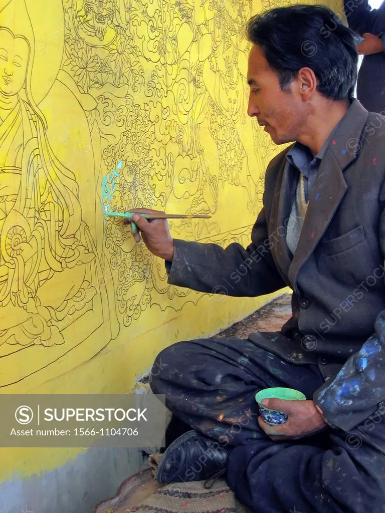 Artist paints religious mural at Sera Monastery Lhasa Tibet