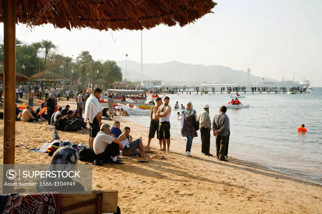 People on the public beach of Aqaba, Jordan