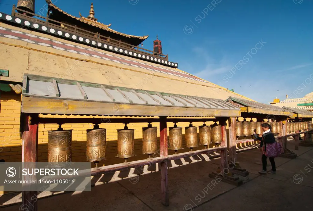 pilgrim spinning prayer wheels at Gandan Monastery in Ulan Baatar, Mongolia