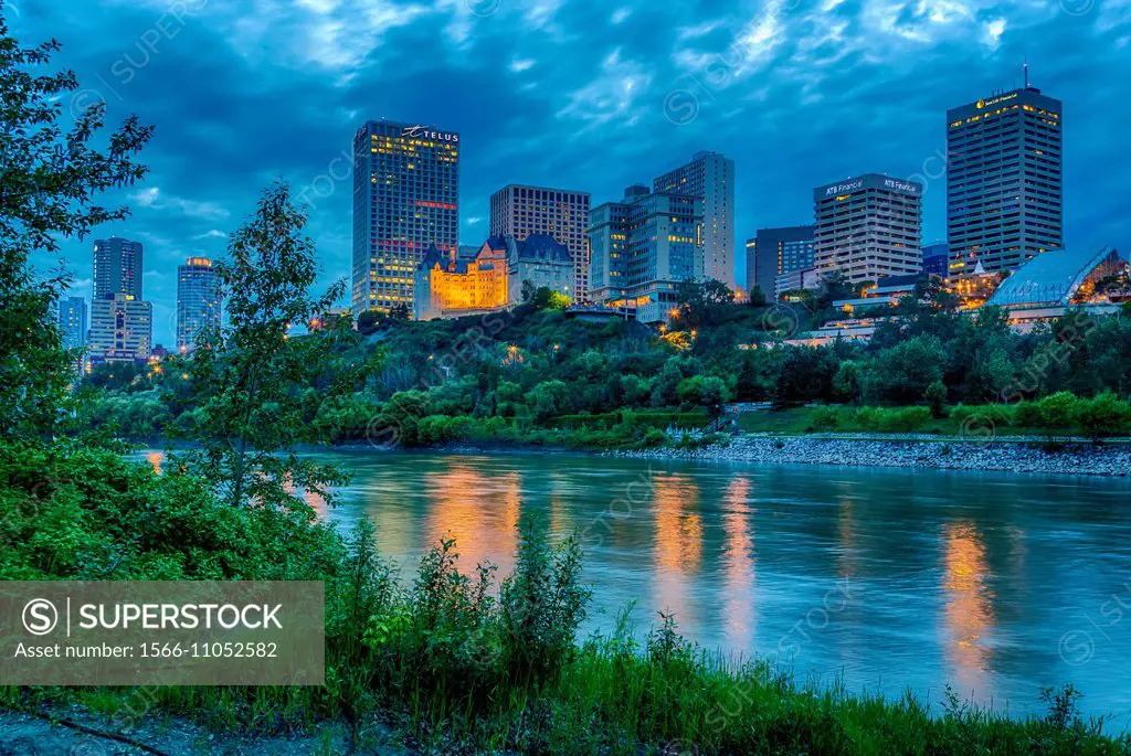 The city skyline of Edmonton, Alberta, Canada and the North Saskatchewan river at dusk.